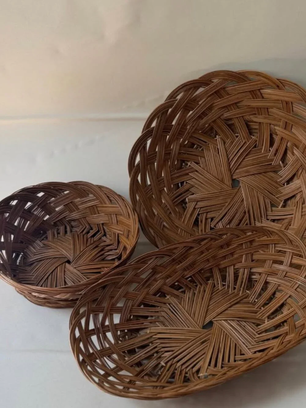 Set of Three 1970s Hand-Woven Rattan Baskets
